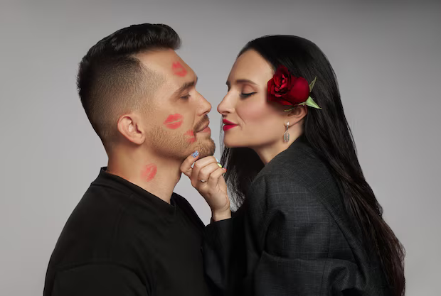 image-couple-love-kissing-lipstick-marks-their-face-kiss-rose-flowers-love-hugs-man-woman-husband-wife_91497-11593