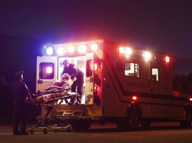 image-paramedics-carrying-patient-in-ambulance-at-night