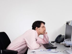 image-bored-male-office-worker-at-desk